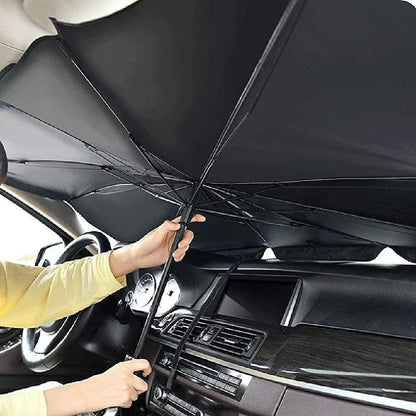 Person holding a black umbrella inside a car. Car thermal insulation umbrella shade blocking heat and UV rays for comfortable driving experience