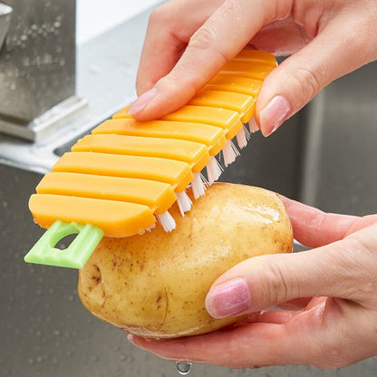 Carrot shaped vegetable scrubbing brush for potatoes and fruits