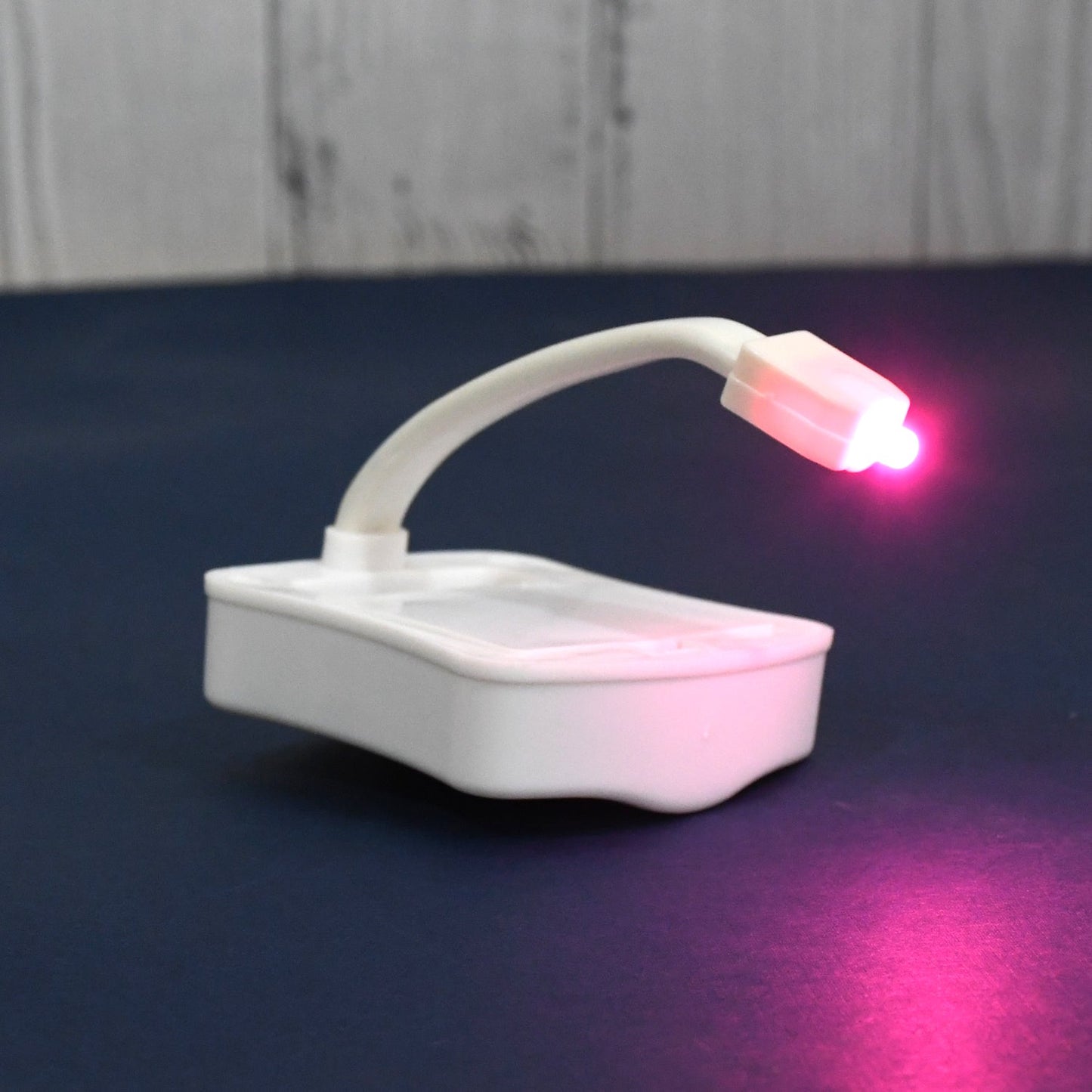 Motion sensing battery LED toilet light clamp