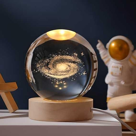 3D crystal lamp ball displaying 16 colors LED lighting effects on wooden table surface