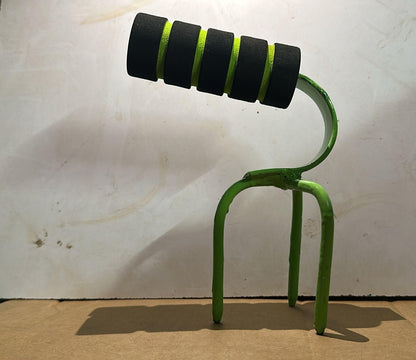 Green and black exercise tool on a white background, Lawn maintenance aerator showing alloy steel construction and sharp spike soil turning effectiveness