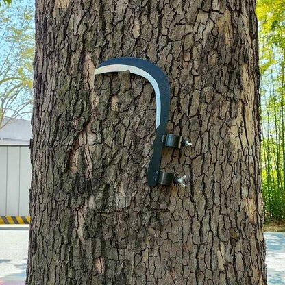 Grass sickle cutter head attached to handle showing curved blade and 28×26×24 cm dimensions