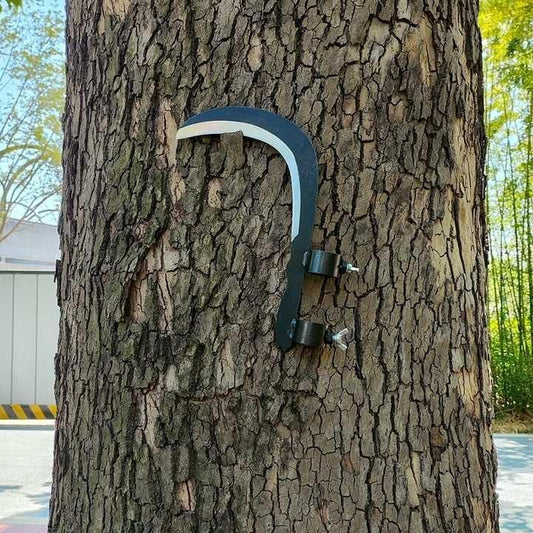 Grass sickle cutter head attached to handle showing curved blade and 28×26×24 cm dimensions