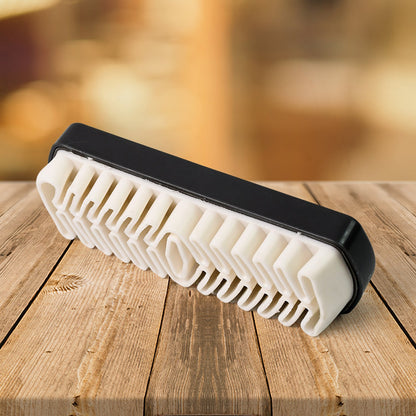 Portable shoe cleaning brush with rubber crepe surface