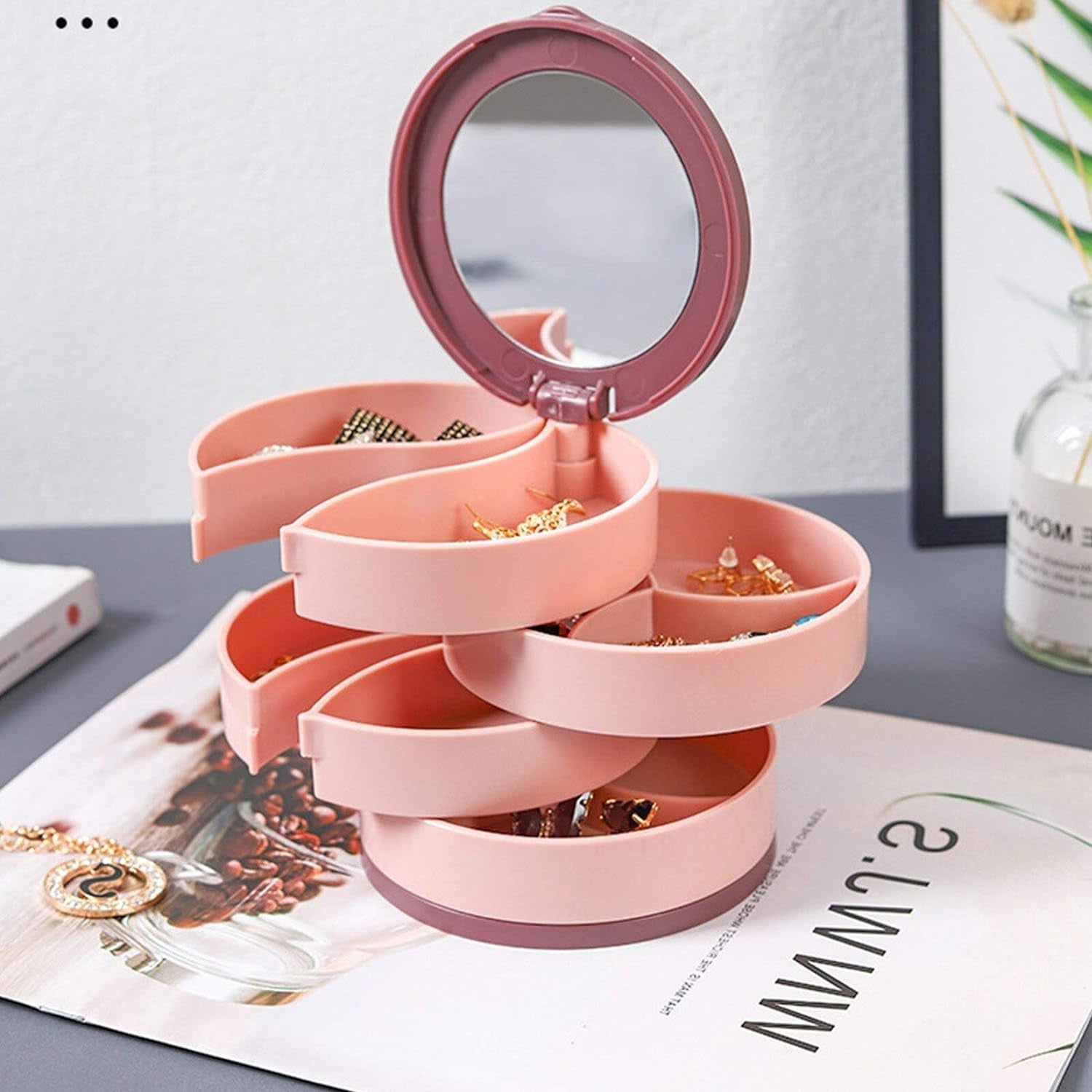 Portable jewelry box with rotating feature, compact for travel and daily home use