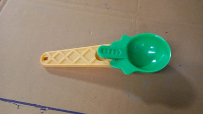 Plastic trigger handle scooping fresh melon balls