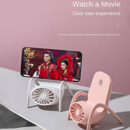 Charging desk fan with integrated phone stand for travel use