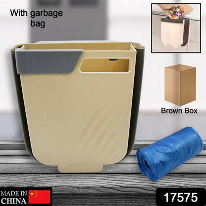Foldable collapsible trash bin placed on countertop in compact kitchen