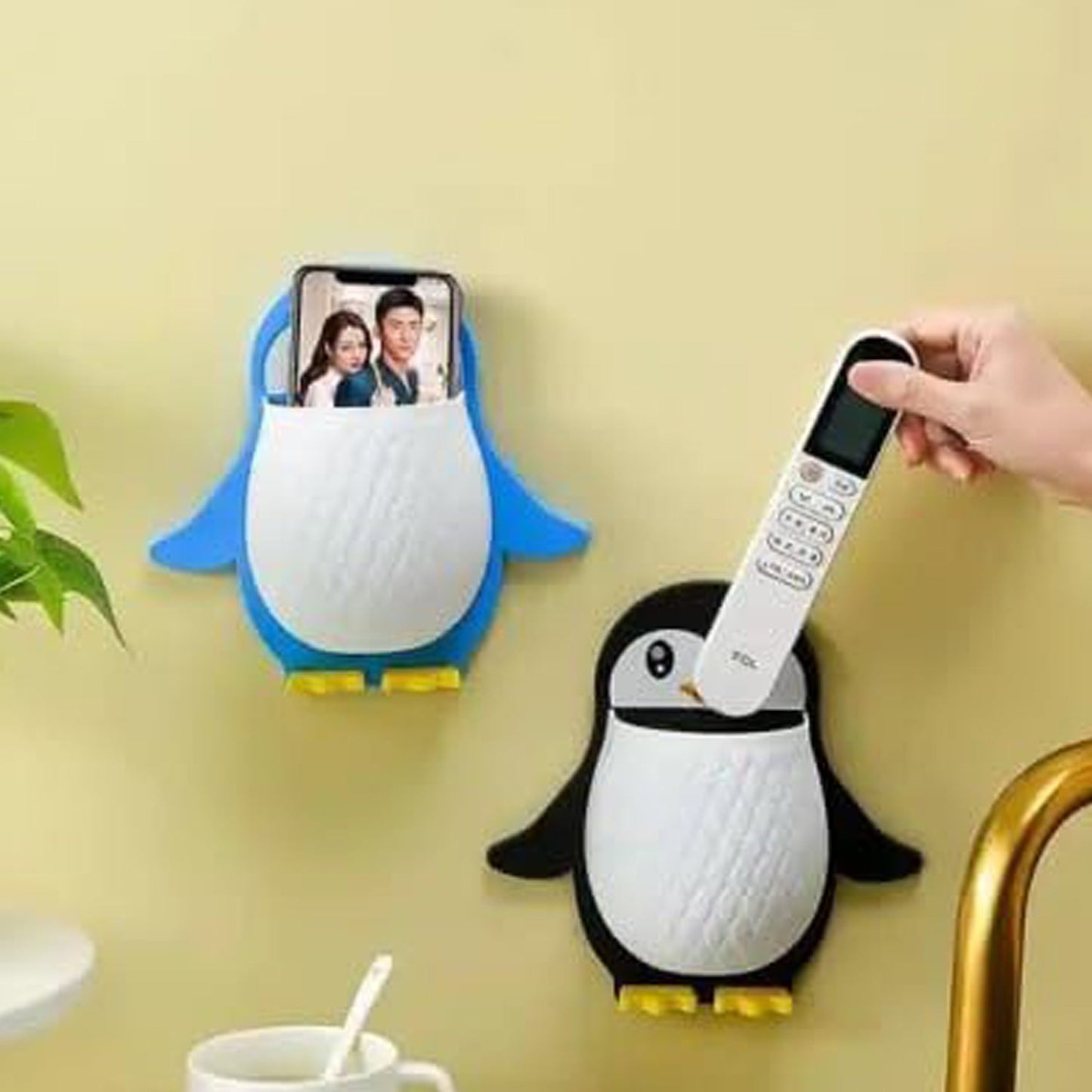 Self-adhesive wall storage caddy in penguin shape