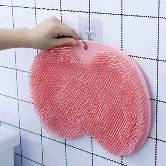 Silicone bath massage cushion with suction cups attached to wall