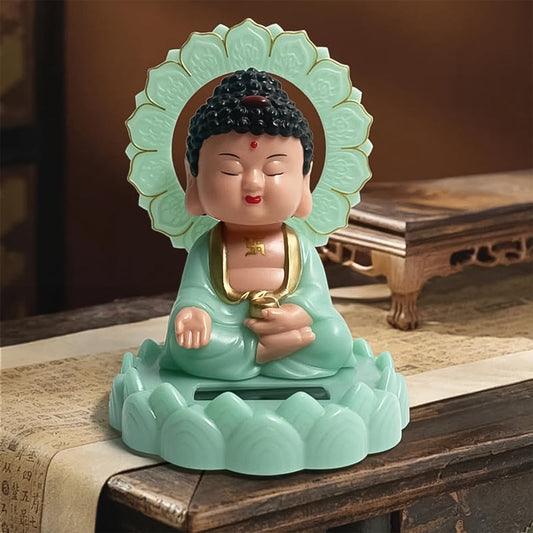 Solar powered nodding Buddha statue plastic with glowing base