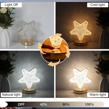 Star shape crystal diamond lamp glowing warmly on a bedside table