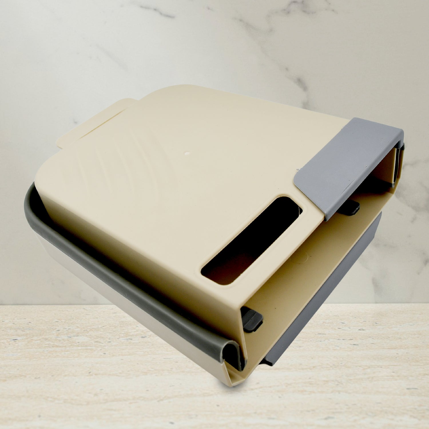 Small collapsible trash can folded flat for storage in limited spaces