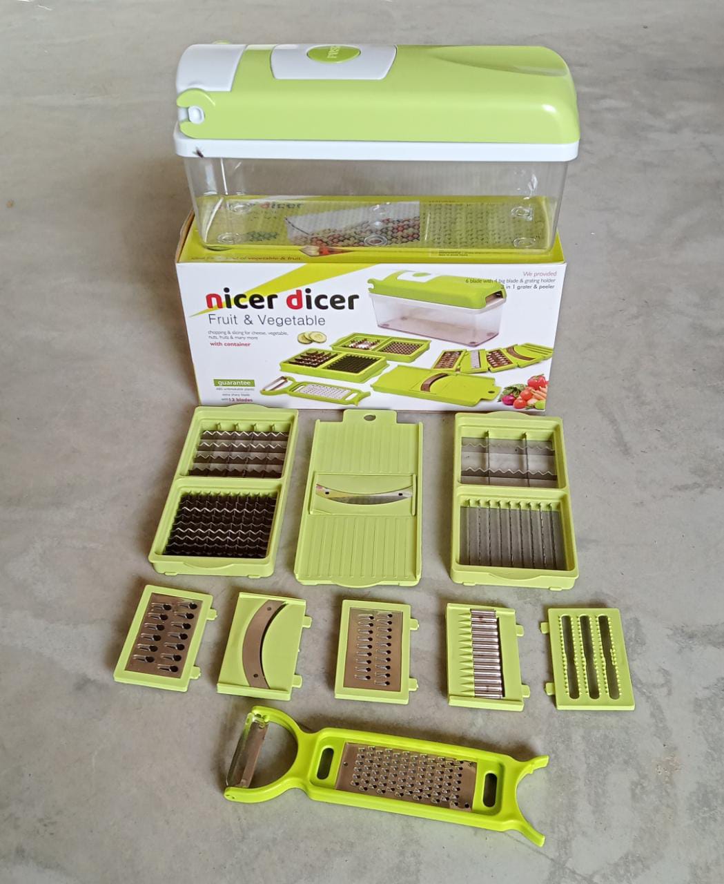 Plastic 13-in-1 grater and slicer with various tools for kitchen use. vegetable chopper, 13 in 1 chopper, multipurpose cutter, fruit slicer, kitchen grater, vegetable slicer set, kitchen tools combo, plastic chopper with container, stainless steel vegetable cutter, fruit chopper